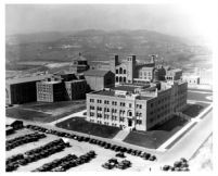 Aerial view of Physics-Biology Building (Humanities Building) with Library (Powell Library) and Royce Hall in background, 1930
