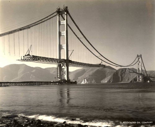 Looking towards Marin County from Fort Point in San Francisco, as the floor of the Golden Gate Bridge takes shape, October, 1936 [photograph]