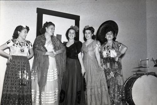Five women entertainers facing camera