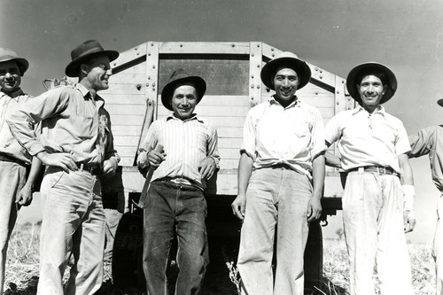 Robert Barr with four Mexican workers behind truck