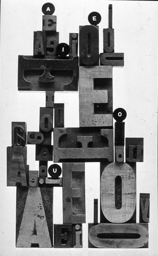 A book cover for Scott Forsman made up of wooden vowels