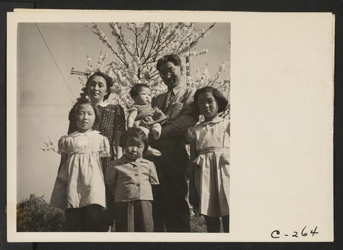Henry Mitarai, age 36, successful large-scale farm operator with his family on their ranch about six weeks before evacuation. This family, along with other families of Japanese ancestry, will spend the duration at War Relocation Authority centers. Photographer: Lange, Dorothea Mountain View, California