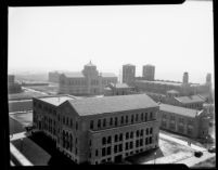 Aerial view of Chemistry Building (Haines Hall) with Library (Powell Library) and Royce Hall in background, 1930