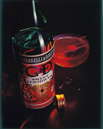 A bottle and glass of Gambarelli and Davitto D & G Sweet Vermouth