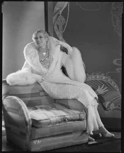 Peggy Hamilton modeling an ermine coat chiffon evening gown, 1931