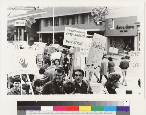 View of pickets with signs on Bancroft Way at Telegraph Avenue